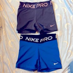 Two pairs of Nike Women’s pro spandex shorts - 3” in size small. GUC!